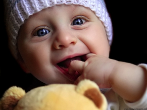 Cute baby playing doll