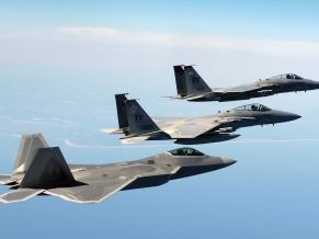 An FA 22 Raptor Two F 15 Eagles