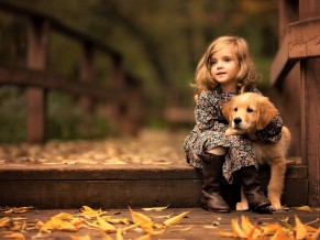 Cute Little Girl with Golden Retriever Cub
