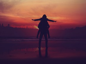 Happy Couple Enjoying Sunset